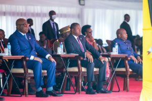 Faure Gnassingbé and Yoweri Museveni shaking hands at the event