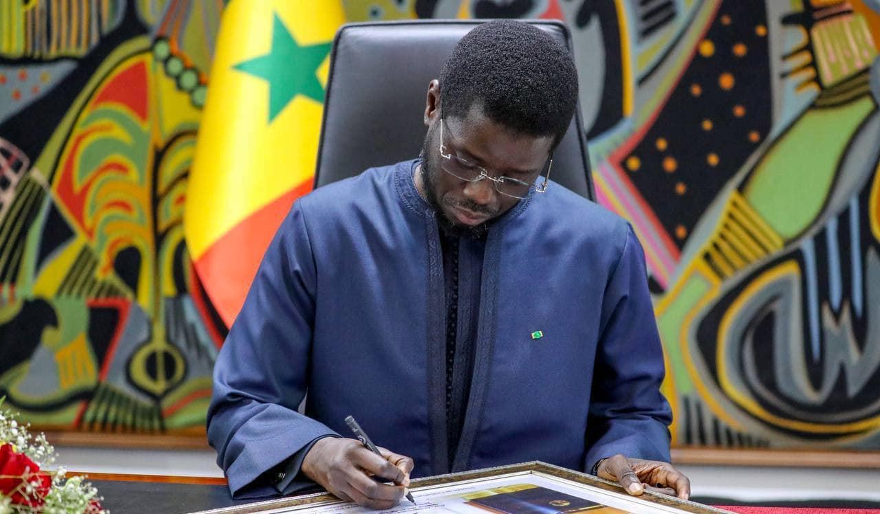 President Bassirou Diomaye Faye signing electoral reforms