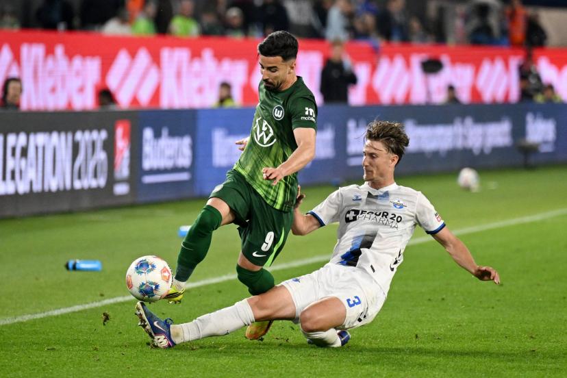 Wolfsburg's lineup, led by Mohammed Amoura, faced tough resistance from Paderborn's defense under Jonah Sticker's leadership. (Teresa Kroeger/Reuters)