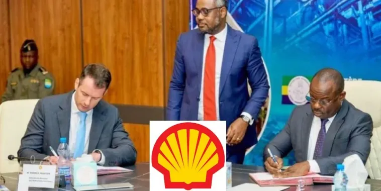 Shell's return to Gabon Shell executives and Gabonese officials shaking hands
