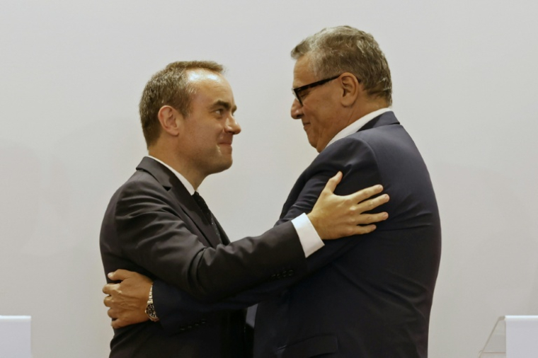 Prime ministers Lecornu and Akhannouch embrace after talks in Rabat